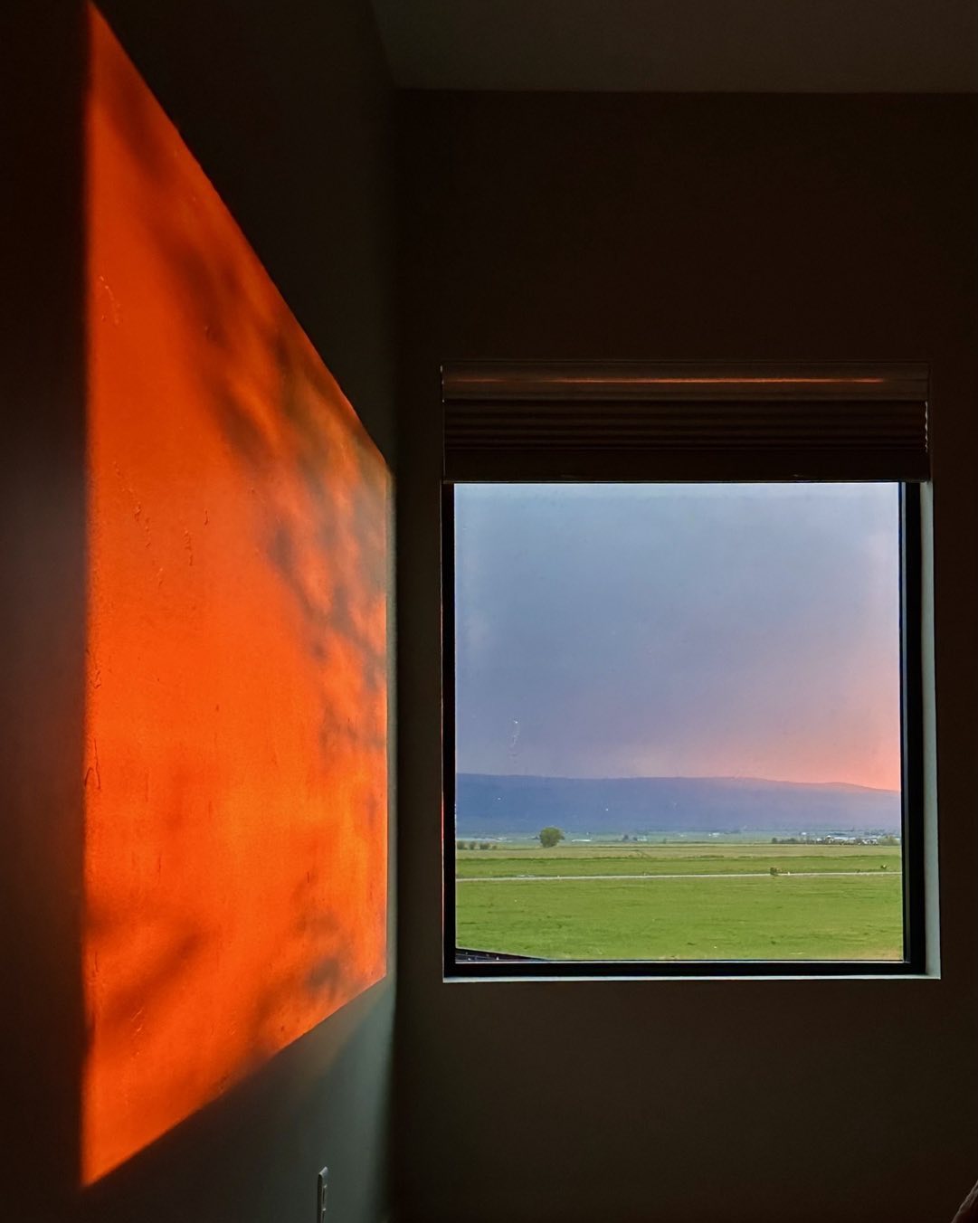 Sunset reflected on our bedroom wall this evening. A heavy cloud cover with just a sliver of clearing on the horizon at sunset created this artistic composition. It lasted for a few minutes! #tetonvalleyidaho #driggsidaho #bestofthegemstate #idahosunsets