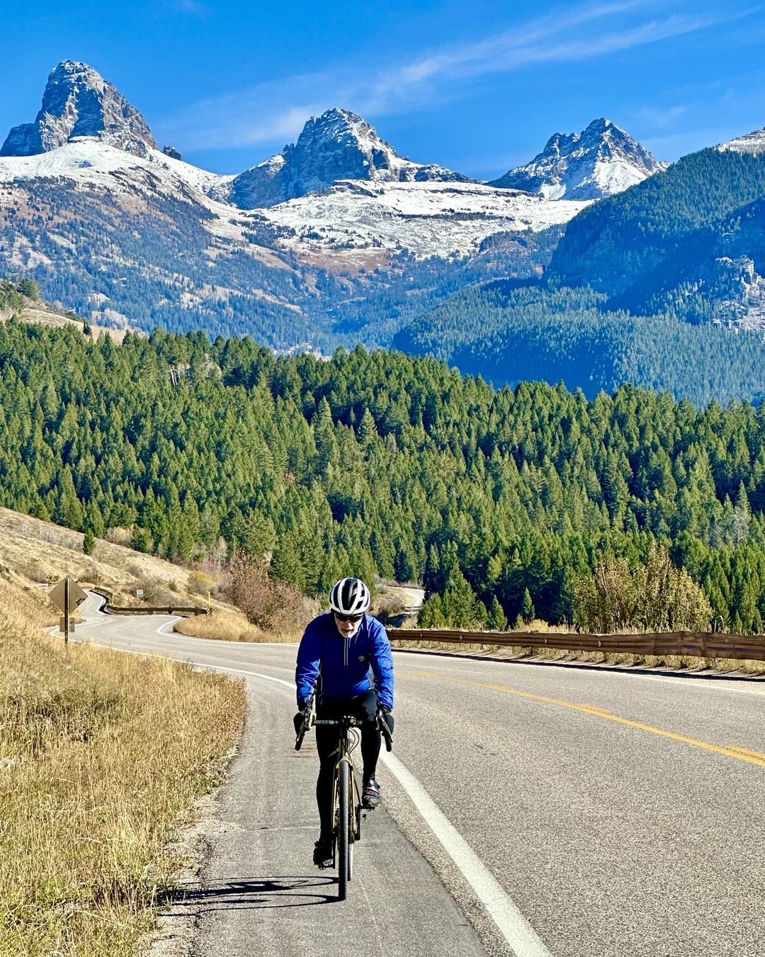 Riding up Ski Hill Road toward Targhee last week. Light snow on the Tetons now and more to come this coming week!