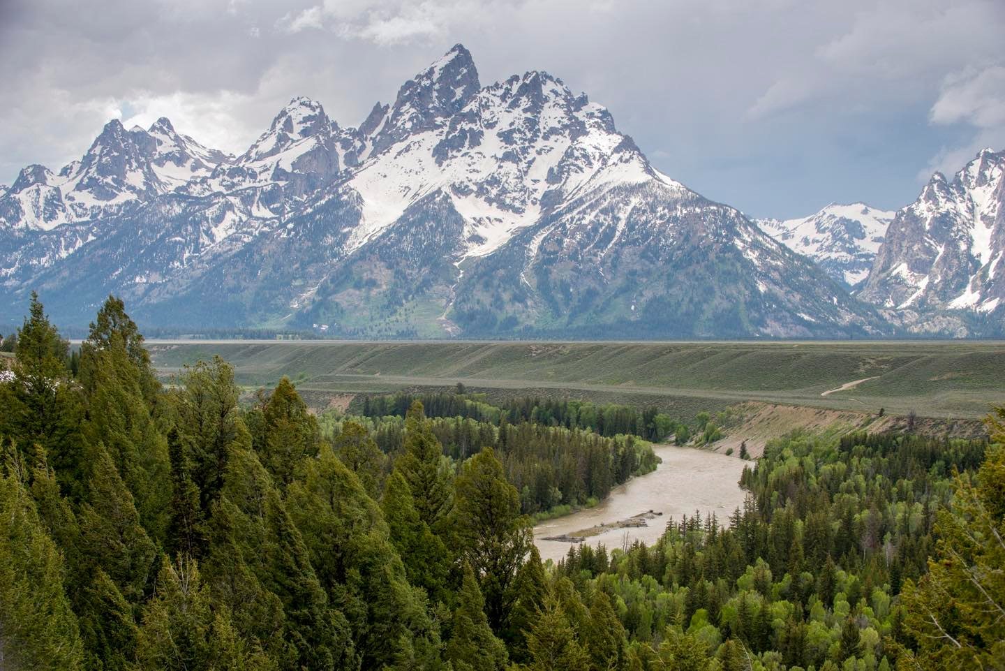 Snake River Overlook in Grand Teton National Park was near the spot, where Ansel Adams made the famous photo, “Snake River and Teton Mountains” in 1942. With spring conditions snow in the foreground has melted, but the Tetons still have abundant snow cover.